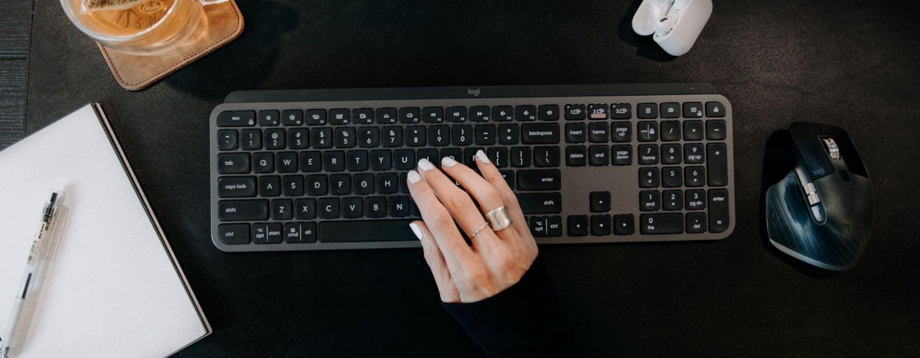 a person typing on a keyboard